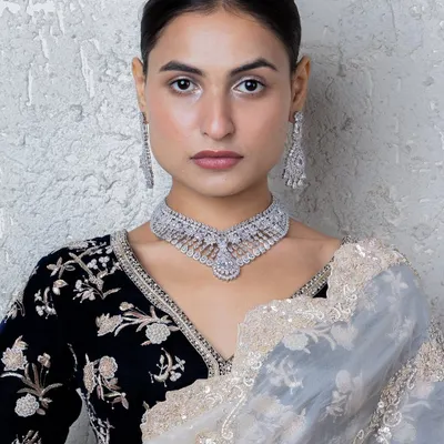 Make a statement with luxury and elegance. This American diamond choker from our new collection showcases a brilliant sparkle and graceful detailing.