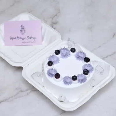 This blueberry bento cake is a customer favorite. It's a 4-inch mini cake, perfect for a personal celebration, and comes packed in a cute takeout box.