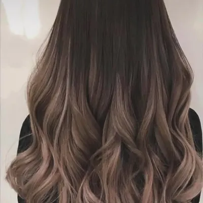 A beautiful example of a soft balayage with gentle waves. This technique creates a natural, blended look that grows out beautifully.