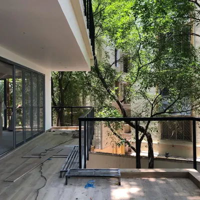 This is the 'before' view of a client's new balcony. A space like this, with its beautiful connection to the surrounding trees, is full of potential. It represents the beginning of our journey to create a new garden home.
