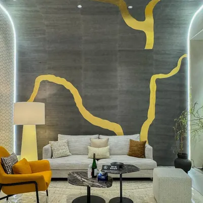 This award-winning metallic leaf wallcovering is a true showstopper. Inspired by the ancient Japanese art of Kintsugi, the grand-scale golden design flows across a dark, textured background, creating a powerful statement of strength and beauty.