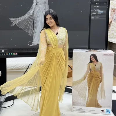 I had so much fun turning my favorite outfits into these collectible 3D figures. This one features a beautiful yellow draped saree, capturing the flow and design of the real outfit.