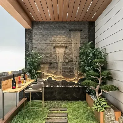 A luxurious balcony featuring a custom bar, a tranquil water feature, and lush greenery. This design creates a perfect setting for entertaining guests or enjoying a quiet evening drink.