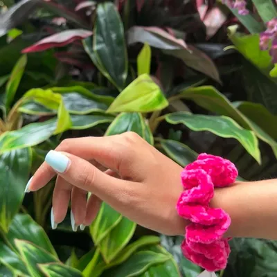 This vibrant pink velvet scrunchie is one of my favorites. The crochet technique gives it a unique, plush texture that's really comfortable to wear.
