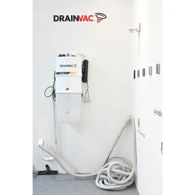 This is our Drainvac central vacuum unit, a key component of our home wellness solutions. By venting dust and allergens completely outside the home, it drastically improves indoor air quality and is an essential system for families concerned with allergies and respiratory health.