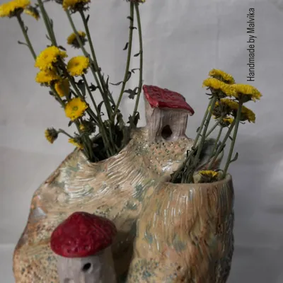 A piece from my 'Houses on Cliff' series, styled with fresh yellow flowers. Each house is hand-built and attached to a wheel-thrown base, creating a miniature landscape inspired by my mountain travels.