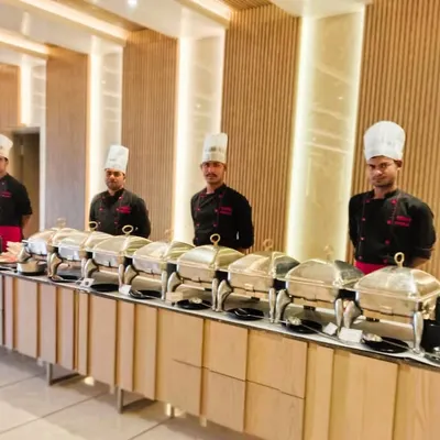 An elegant buffet setup for a dinner party at Prestige Primrose Hills. Our team ensures the catering looks as good as the beautiful venue.