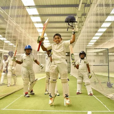 The pure joy of cricket. Young players celebrate in the indoor nets, showcasing the enthusiasm and fun that defines weekends at JCA.