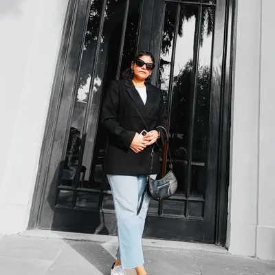 This is my go-to uniform for a reason. A classic black blazer over a white tee and light-wash jeans is a timeless combination that always looks polished. Paired with white sneakers, it's the perfect blend of smart and casual.