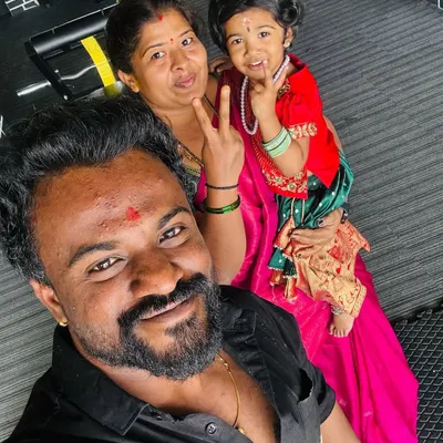 A selfie with my wife and daughter in the gym. This is my world. I bring this same sense of family and protection to my camp, ensuring every child is cared for.