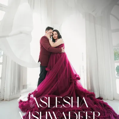 A romantic embrace captured in a bright, airy room with flowing white curtains. This style of pre-wedding photography creates a soft, dreamy, and elegant portrait.