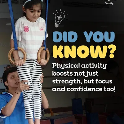 Physical activity boosts not just strength, but focus and confidence too. Here, a coach assists a grade-schooler on the rings, helping her build upper body and core strength.