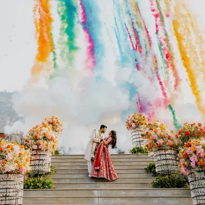 A truly explosive start to a new chapter. This engagement shot captures the couple against a backdrop of colorful smoke, a moment of pure joy and celebration that I meticulously planned and executed.