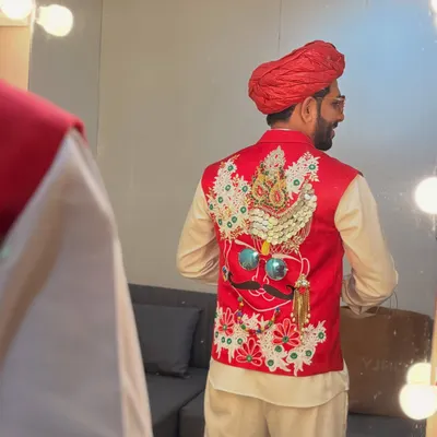 The back of this red Rajasthani-style vest features an incredibly detailed, handcrafted design. It's these unique details that make an outfit stand out on stage.