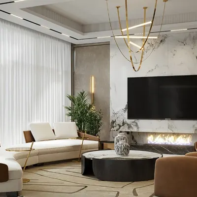 This view of the living area highlights the interplay of textures, from the smooth marble wall to the soft rug and leather armchairs. Every element is chosen to contribute to a cohesive and luxurious feel, making the space perfect for hosting guests or enjoying family time.