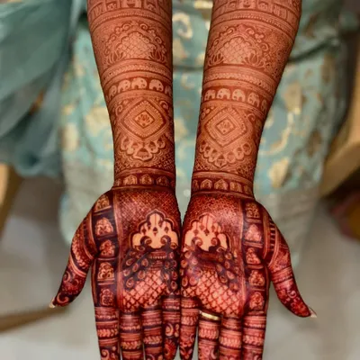 This is the fresh, deep red stain that develops from my natural henna paste. The color is rich and even across the intricate design.