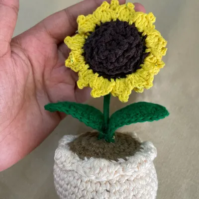 A close-up of my handmade crochet sunflower. I designed this to be a symbol of loyalty and happiness. It’s a perfect little gift to tell someone "I'll stay," and it will never wilt.