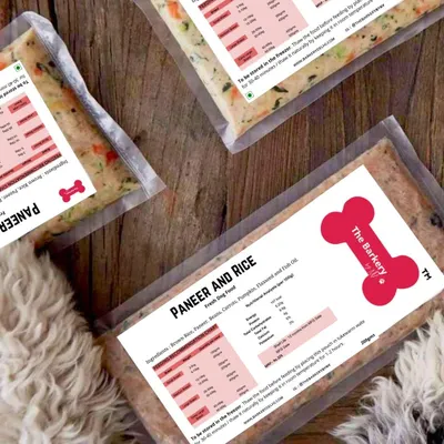 Our Paneer and Rice meal is a perfect, protein-packed vegetarian option for dogs. You can see the real ingredients right through the package, including carrots and brown rice, with a furry friend already eager to get a taste.