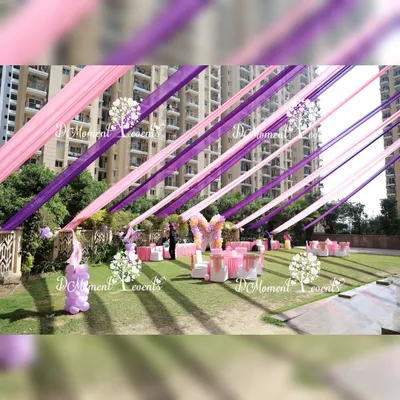 We transformed this outdoor lawn into a magical wonderland with vibrant pink and purple ceiling drapes for a butterfly-themed birthday. This full-scale event design included themed decor, seating arrangements, and activity stations, creating a completely immersive experience for the guests.