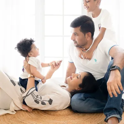 A candid moment from a beautiful family photoshoot in Bangalore. It's these unposed, playful interactions that truly capture the love and connection you share.