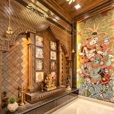 A breathtaking, traditional pooja room with intricate wood carving and a stunning mural of Radha and Krishna. This space is a true testament to artistry and devotion.