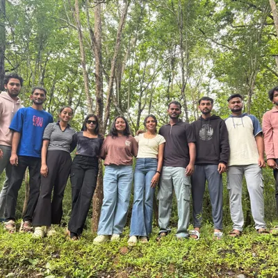 A happy group of adventurers posing for a photo in the forest. Our trips are a great way to meet like-minded people.