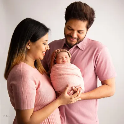The love in a family's eyes as they hold their new baby is pure magic. We took a moment during this session for a beautiful family portrait, with everyone glowing.