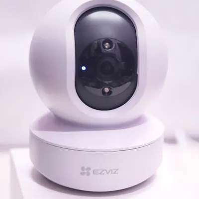 The EZVIZ TY1 Smart Home Camera, shown here with its power indicator on. This model offers 360 degree visual coverage with motorized pan and tilt, all controllable from your smartphone.