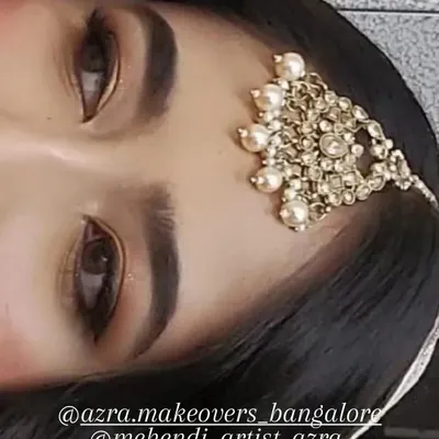This is a close-up of my signature engagement eye makeup. The look is created with neutral tones, a soft brown smokey effect, and sharp eyeliner to define the eyes beautifully.
