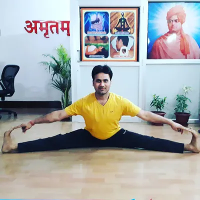 My personal practice is the foundation of my teaching. Here I am in Upavistha Konasana (Wide-Angled Seated Forward Bend), a deep stretching pose that requires patience and consistent practice, principles I encourage in all my students.