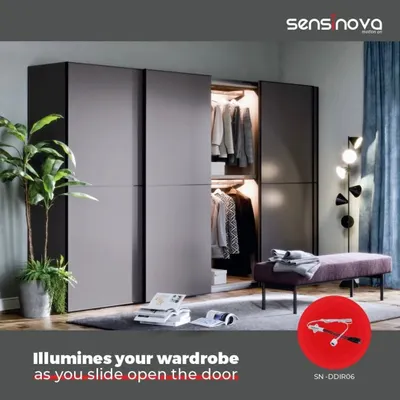 Our smart sensor solutions extend to your wardrobe. This image shows how a Sensinova door sensor automatically illuminates your closet as you slide open the door, making it easy to find what you need.