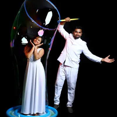 This is a picture perfect moment. We create stunning visuals, like enclosing a guest in a massive, iridescent bubble, perfect for photoshoots, weddings, and adding a touch of magic to your special day.