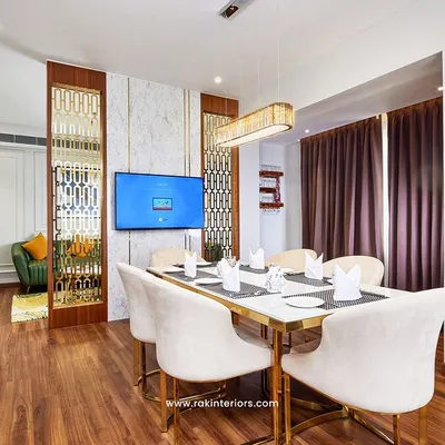 A complete hotel suite designed for comfort and productivity, featuring a dedicated dining area, elegant partition screens, and warm wood flooring. This space is part of my full interior project for the Hotel Travancore Court.