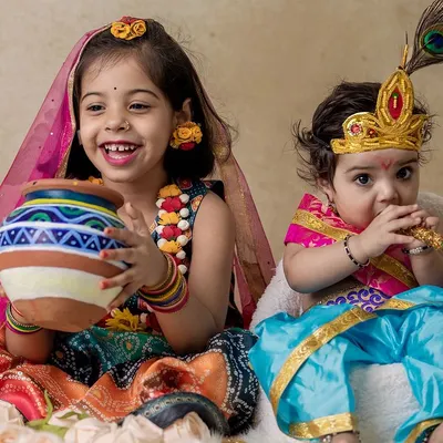 The bond between siblings is so special. Here, I captured a beautiful moment between a sister dressed as Radha and her baby brother as Krishna during a Janmashtami home photoshoot.