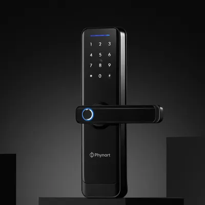 A clean example of product and utility. This hero shot for Phynart's smart lock uses a dark, moody background and focused lighting to highlight its sleek design and glowing fingerprint sensor.