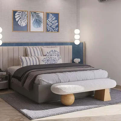 This bedroom design for a DLF Phase 2 project invites calm with a layered palette. The custom bed features a wide, two-tone upholstered headboard, complemented by a sculptural bench and hanging globe lights.