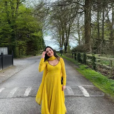 A client looking radiant in our yellow corset anarkali churidar set. Made from self-embroidered georgette, it is intricately highlighted with Dabka embroidery for a touch of tradition.