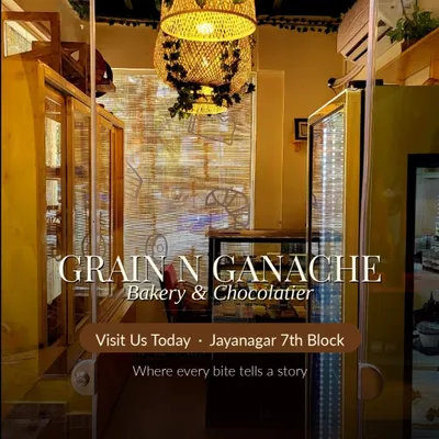 Our Jayanagar bakery entrance opens onto the counter, with yellow framing and the bakery sign above the doorway.