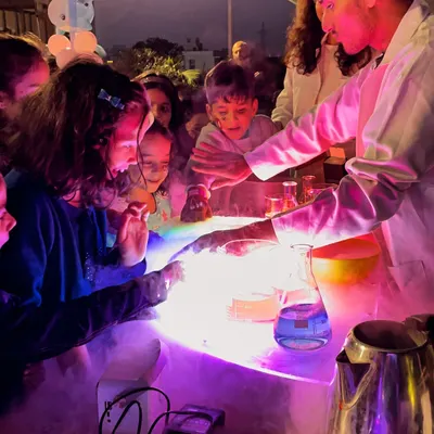 This moment of awe is why we love our science shows. We create a safe, up-close experience where colorful, fizzing, and glowing experiments capture every child's attention and make science unforgettable.