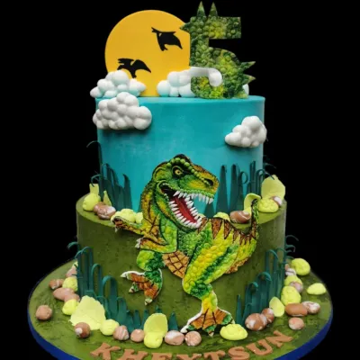 A dinosaur adventure on a cake! This two-tier creation for a 5th birthday features a hand-painted T-Rex, a sculpted dragon, and a fun prehistoric landscape.