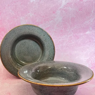 These stoneware pasta bowls are one of my most requested items. They have a wide rim that is perfect for catching sauce, and the speckled gray glaze is understated and elegant.
