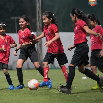 An action shot from one of our girls' football tournaments. We focus on creating high-energy, competitive matches for all our female athletes.