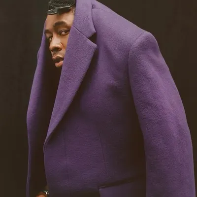 This is an example of my avant-garde and conceptual work. The unconventional styling of this purple tweed coat challenges traditional menswear norms, positioning it as a piece of wearable art and showcasing my creative direction in trend-setting fashion.