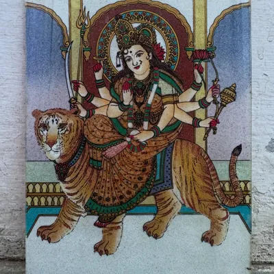 In this piece, Maa Durga is shown as the ultimate protector. The gemstones are chosen to create a powerful and dynamic image, bringing her divine feminine strength and protective energy into your home.