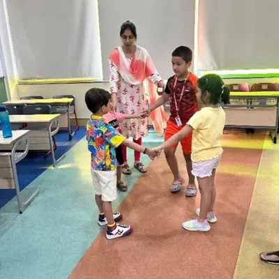 Our dramatics club uses interactive games to teach expression, teamwork, and confidence. Here, students participate in a group activity designed to build non-verbal communication skills and stage presence in a playful environment.