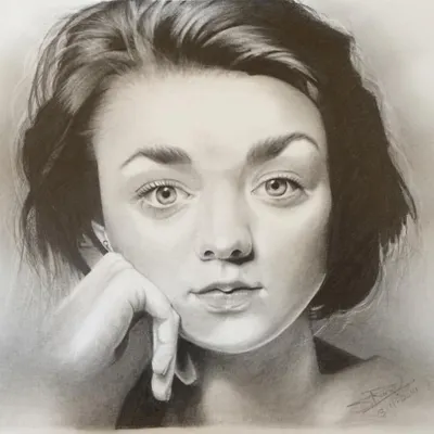 This is a graphite pencil portrait of actress Maisie Williams. I used a range of soft and hard graphite pencils to create the smooth shading on her skin and the fine details in her hair and eyes.