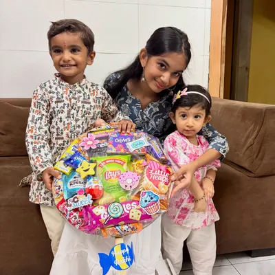 Seeing the smiles on these little faces is why I pour my heart into every creation. This giant lollipop hamper, filled with their favorite treats, was made for a special Rakhi celebration.