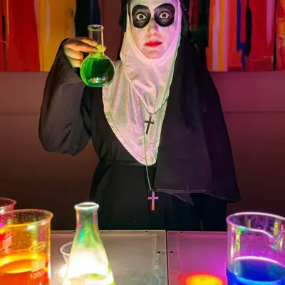 Our hands-on workshops are a huge hit. Here, our expert from Science-O-Mania leads a 'Mad Scientist' session, letting kids mix their own glowing, bubbling potions in a safe and super fun environment.