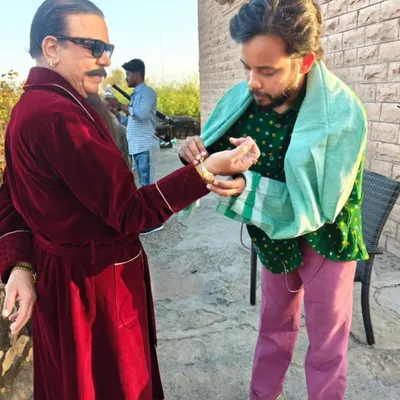 On-set adjustments are a huge part of my job. Here, I'm fitting a bracelet on Govind Namdev ji just before his shot to ensure every single detail of his 'don' character is perfect.