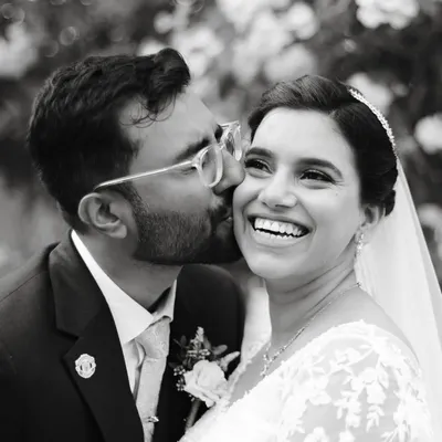 A perfect example of why I love black and white for couple portraits. It removes all distractions, focusing entirely on the joy and connection in this candid moment between the bride and groom.